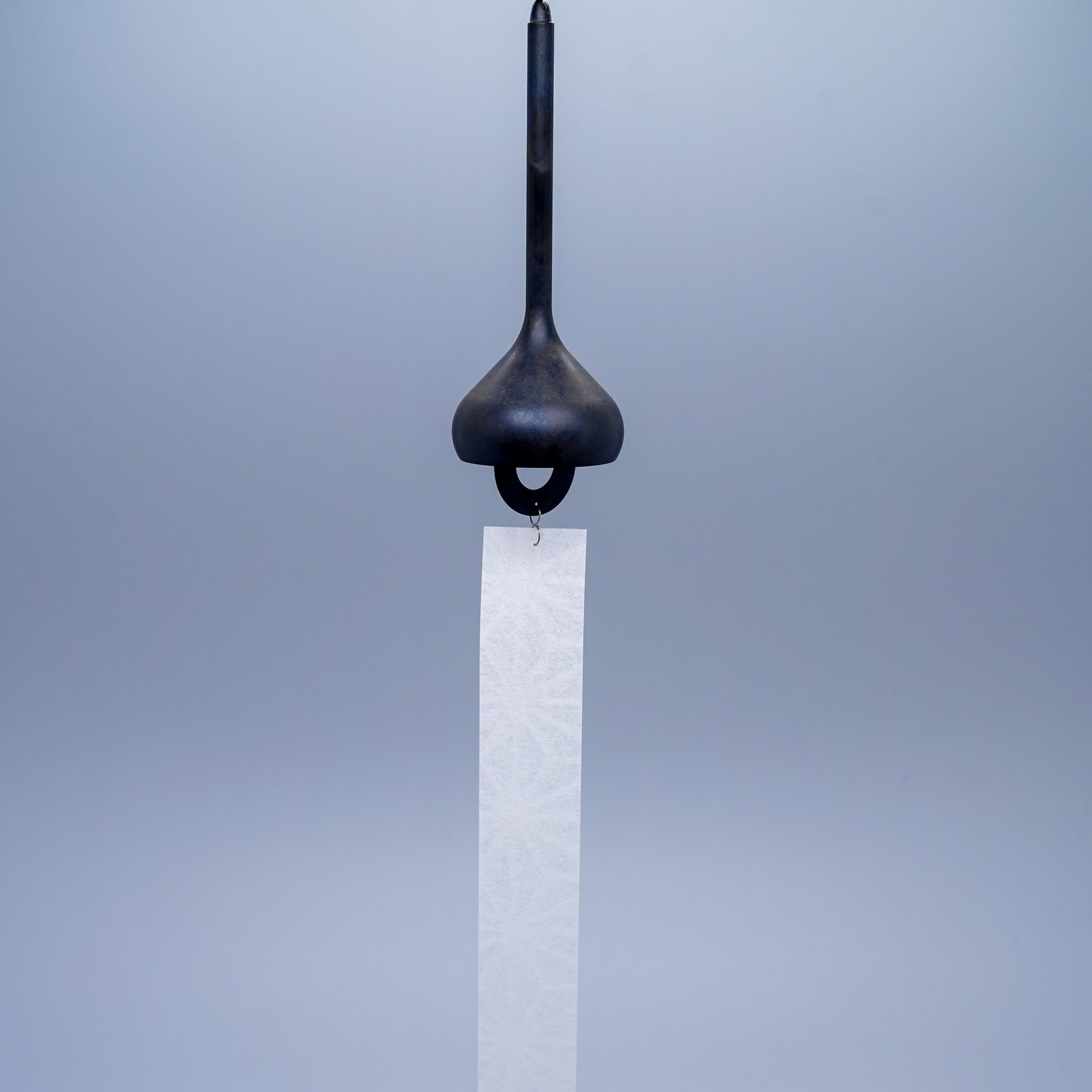 Onion brass wind chime in black by Nousaku, Takaoka, Toyama, Japan, with paper clapper hanging