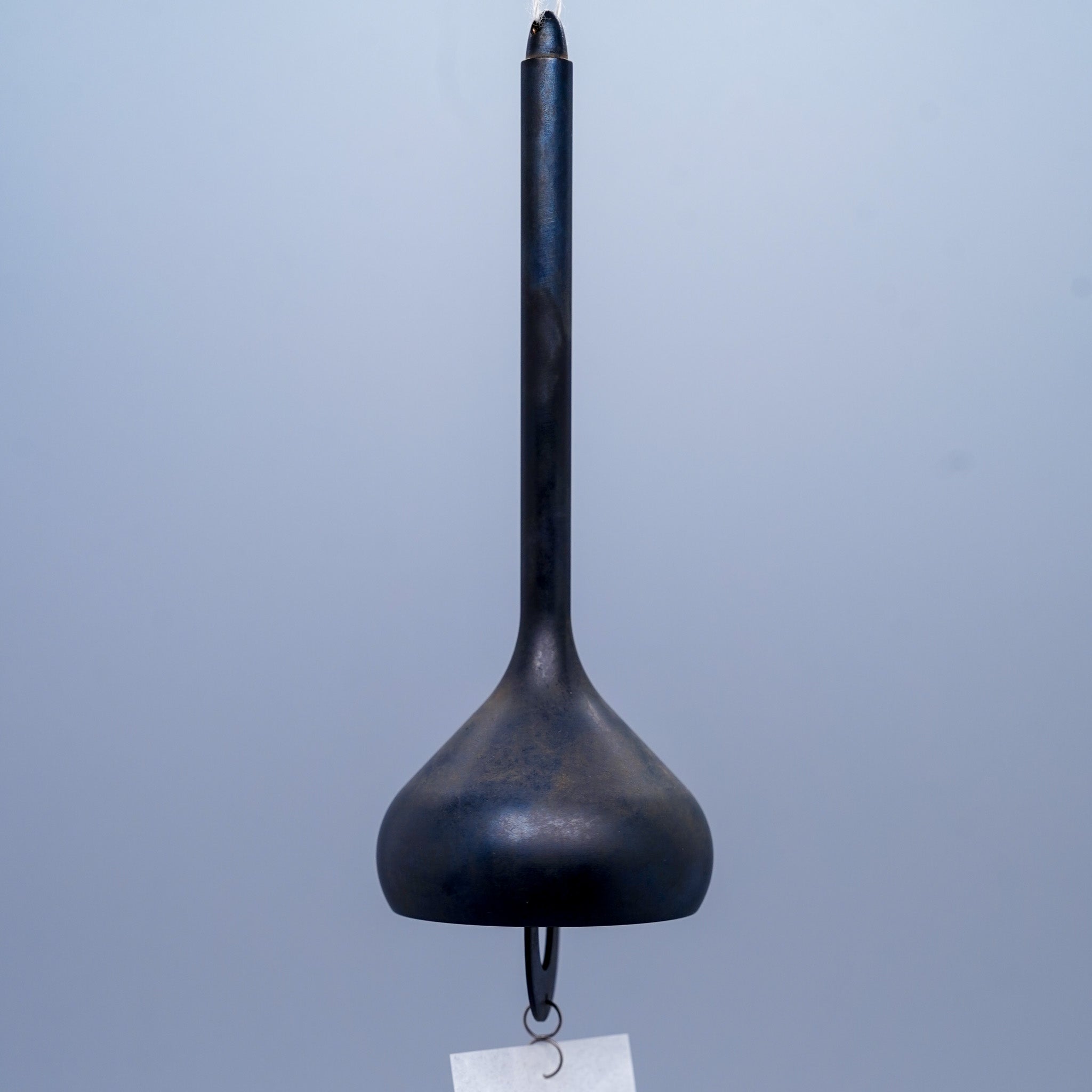 Onion brass wind chime in black close-up showing layered form, by Nousaku, Takaoka, Toyama, Japan