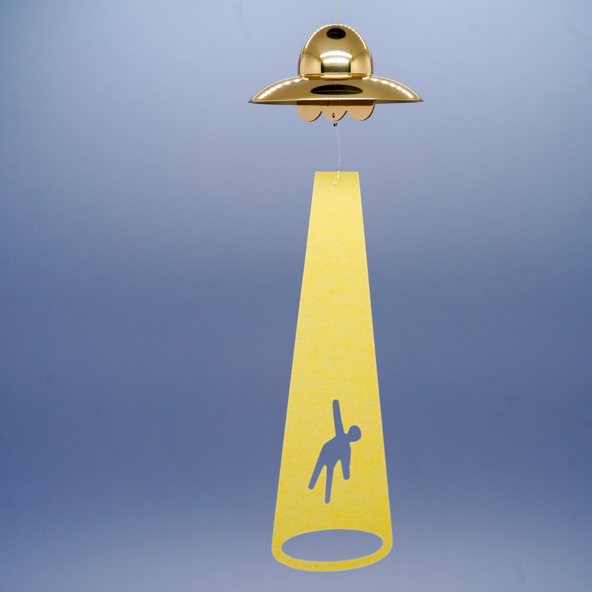 UFO disc-shaped brass wind chime in gold by Nousaku, Takaoka, Toyama, Japan, hanging with beam and silhouette striker