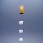 Tsubomi petal-shaped brass wind chime in gold by Nousaku, Takaoka, Toyama, Japan, with cotton ball clappers