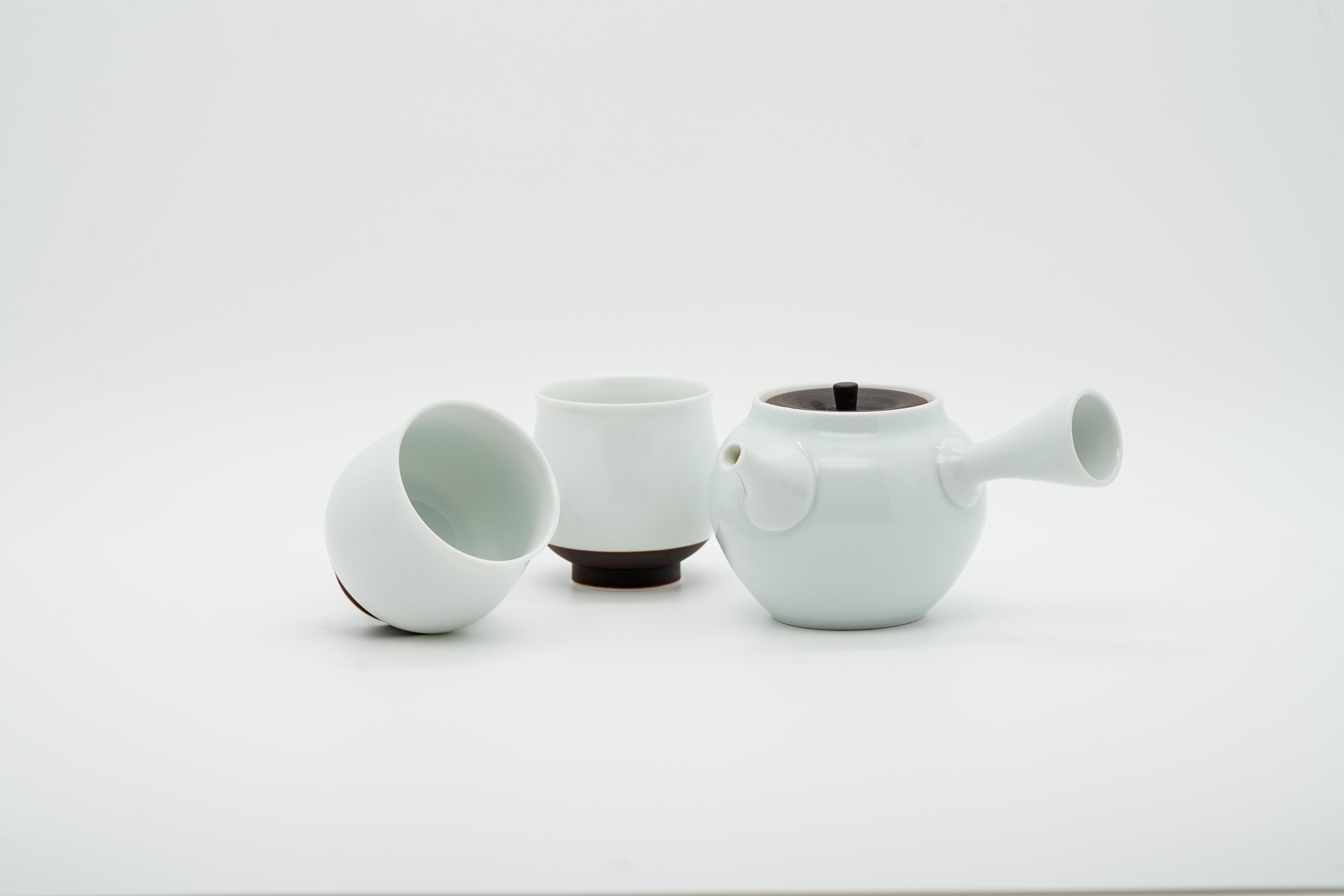 Hasami-yaki white porcelain teapot set showing kyusu, two teacups and lid, handcrafted in Nagasaki, Japan