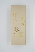 Edo-cat wind chime gold paper strip close-up showing Kuniyoshi ukiyo-e cat illustrations, made in Japan