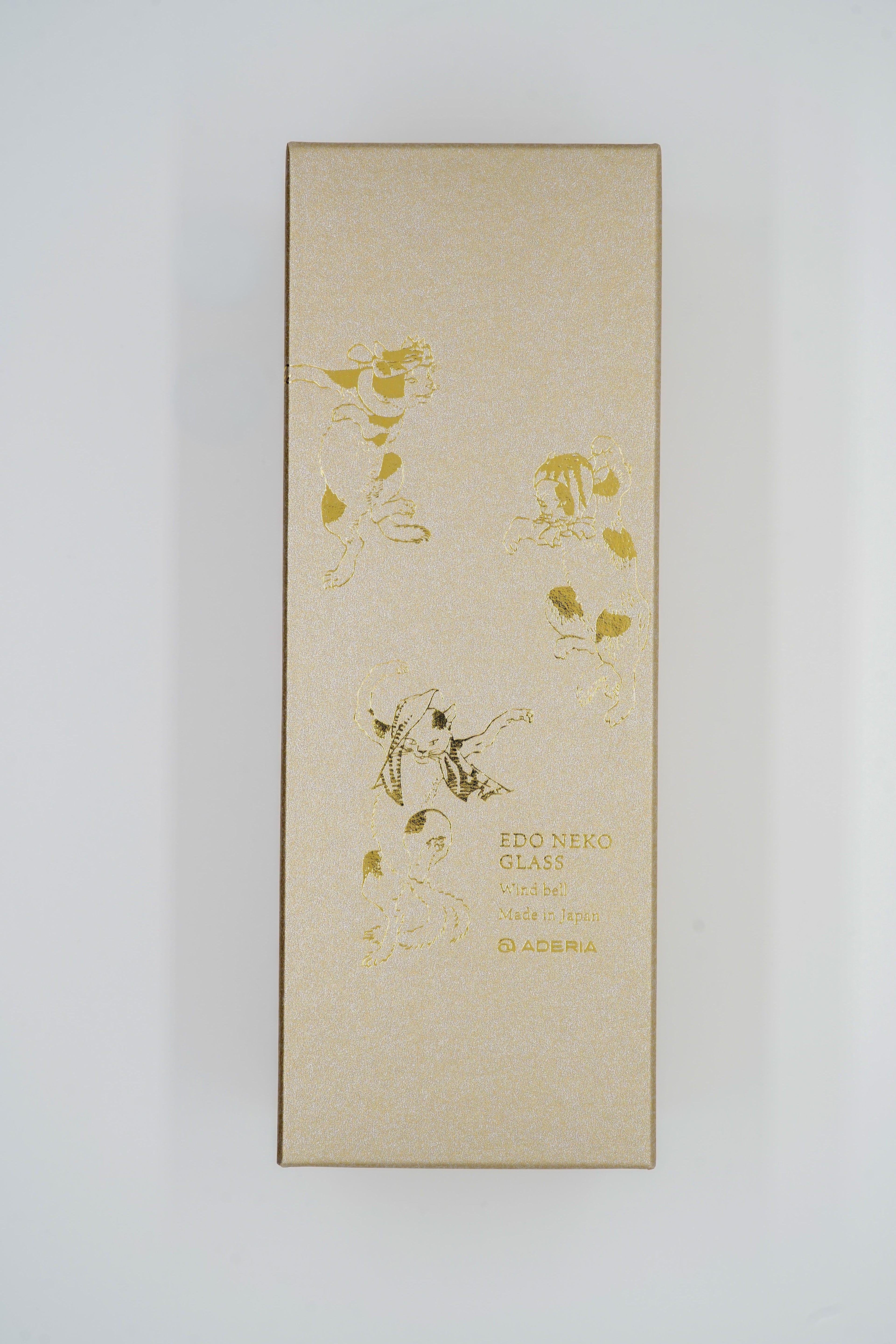 Edo-cat wind chime gold paper strip close-up showing Kuniyoshi ukiyo-e cat illustrations, made in Japan