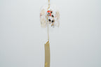 Edo-cat hand-blown glass wind chime angled view showing full bell with ukiyo-e cat motif and gold paper strip, made in Japan