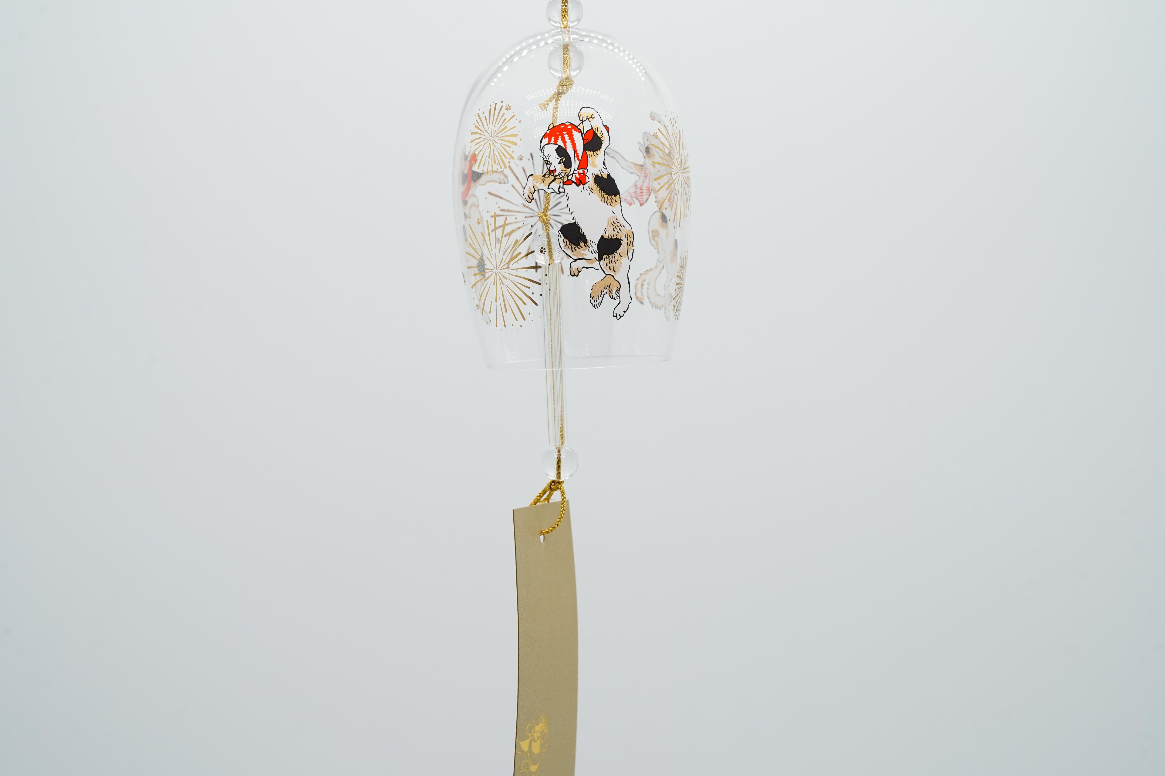 Edo-cat hand-blown glass wind chime angled view showing full bell with ukiyo-e cat motif and gold paper strip, made in Japan