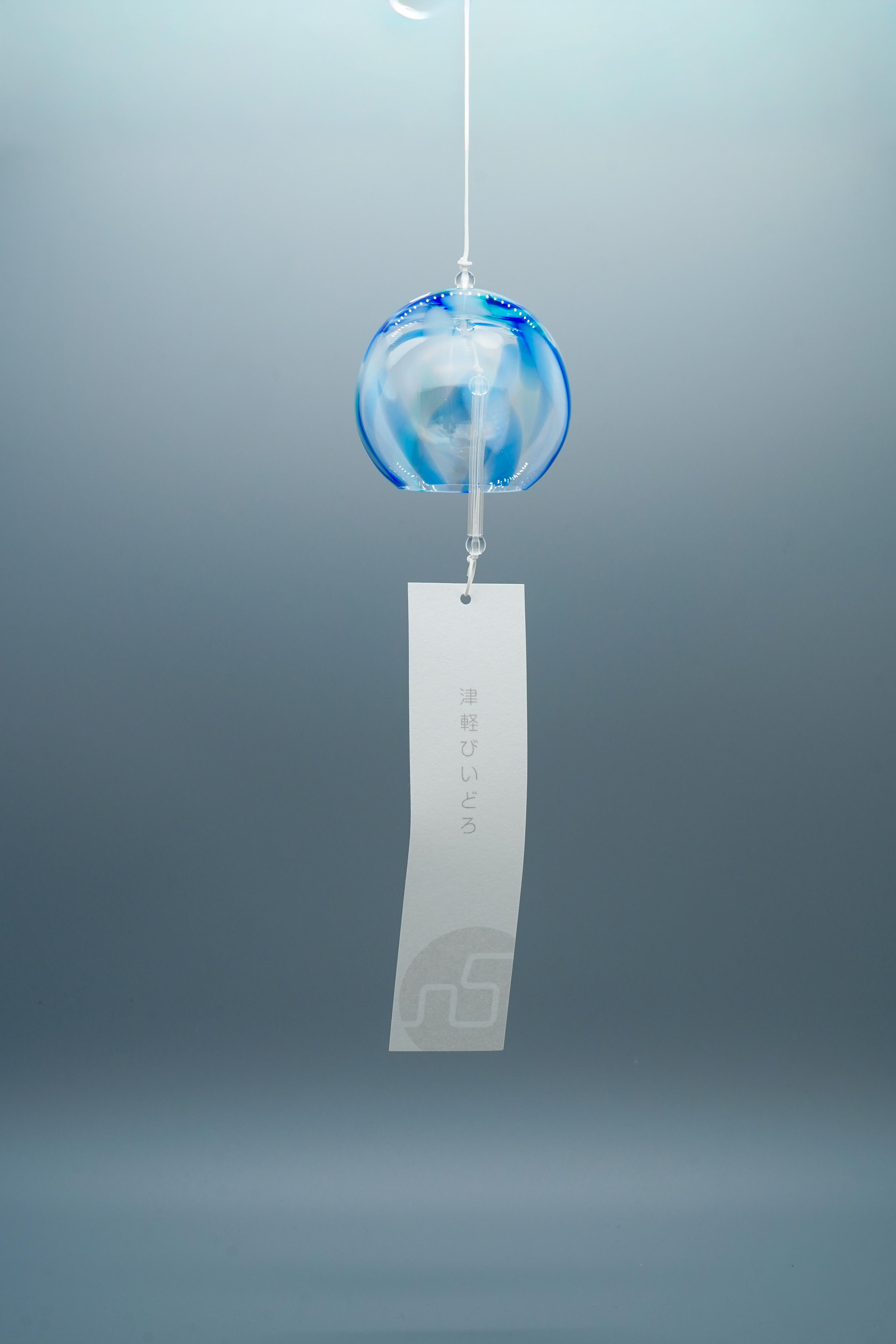 Adelia hand-blown glass wind chime in blue by Tsugaruvidro, Aomori, Japan, hanging with paper strip