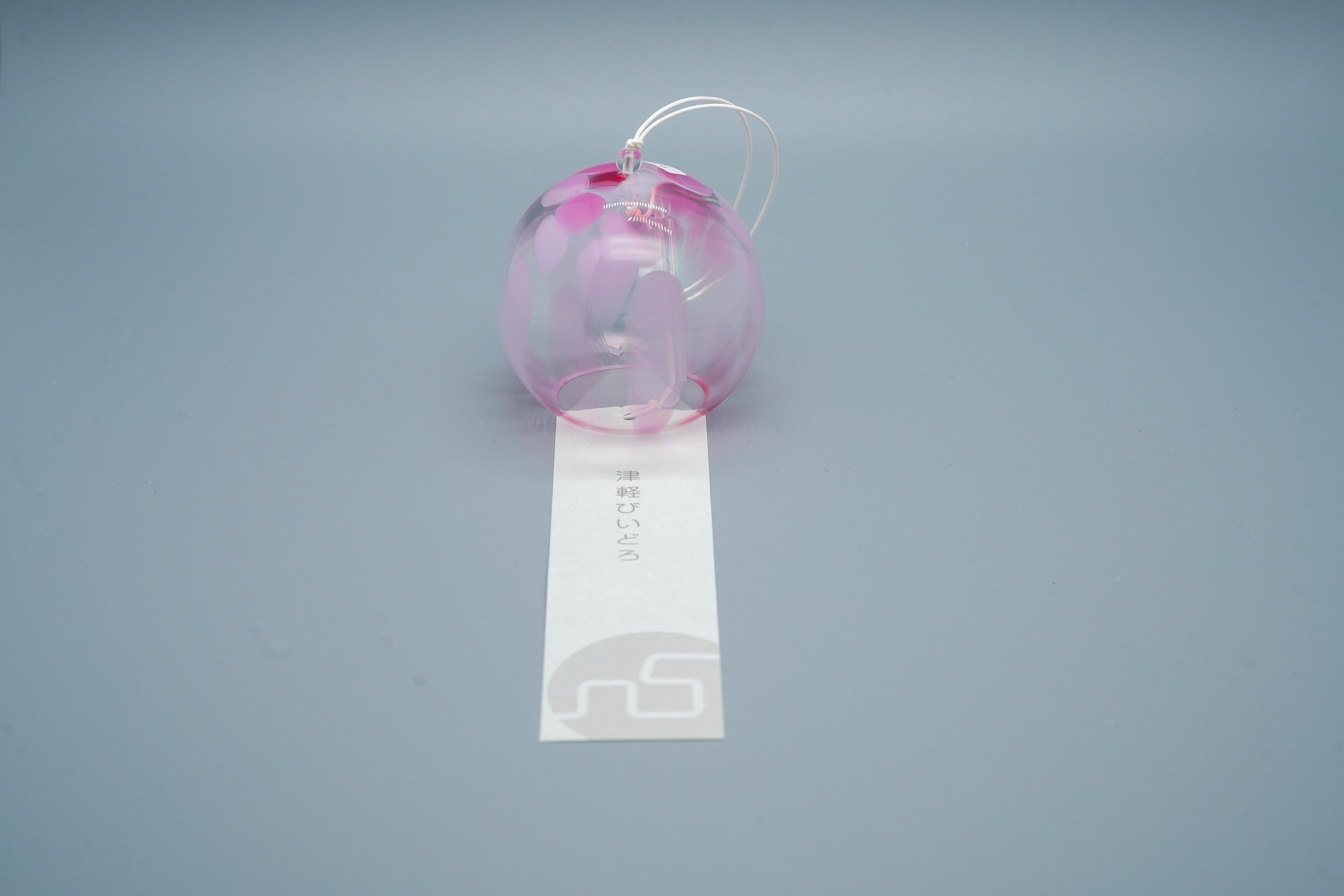 Adelia hand-blown glass wind chime in pink close-up showing floral glass pattern and cord, by Tsugaruvidro, Aomori, Japan
