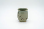 Alternate side of the Soma Eight Horses cup showing running horses curving around the lower body and up the left side.