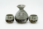 Grey-green crackle-glazed sake carafe and two cups with running horses and heart-shaped openings. 240ml & 30ml. 